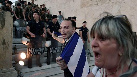 Greek public servants strike over deal